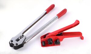 Manual strapping tensioner tool tightening heavy-duty PET strap for industrial packaging.